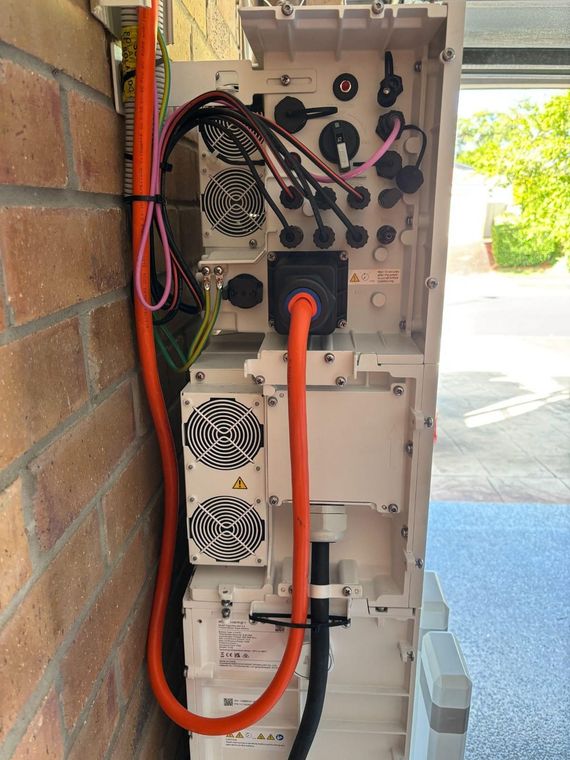 A Sigenergy energy controller on a wall