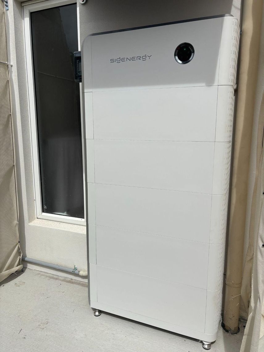 Sigenergy 40 kWh battery stack installed against an exterior wall at a Pimpama home by Evolved Solar