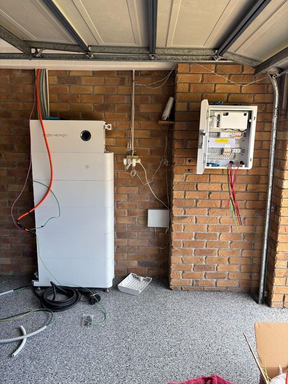 A Sigenergy battery beside the switchboard